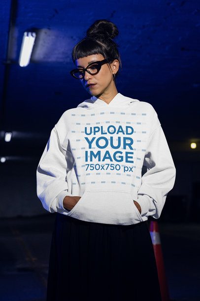 Grunge-Styled Mockup Featuring a Serious Woman With a Gildan Pullover Hoodie
