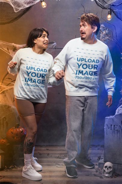 Halloween-Themed Mockup of a Man and a Woman in Matching Gildan Sweatshirts m51246