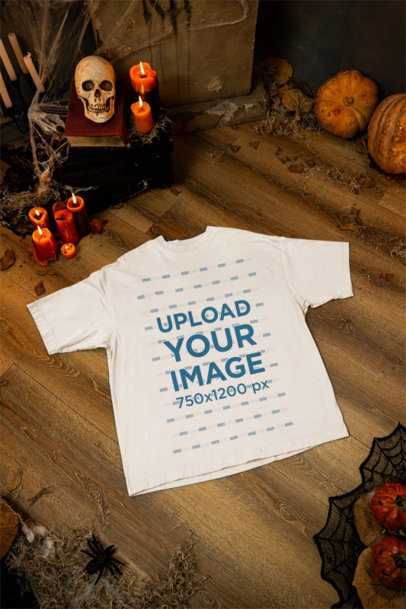 Mockup of a Crewneck T-Shirt Flat Laid in a Halloween-Decorated Setting m51294