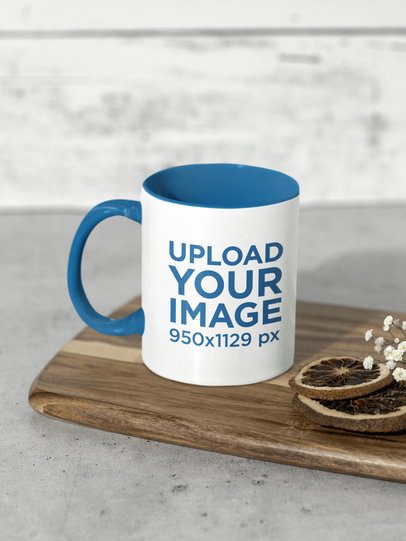 Mockup of an 11 oz Mug with a Colored Handle Placed on a Wooden Chopping Board m51004