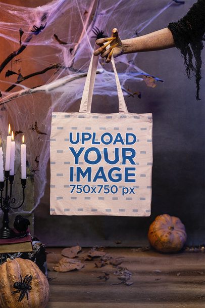 Halloween-Inspired Mockup Featuring a Witch's Hand Holding a Tote Bag  m51278
