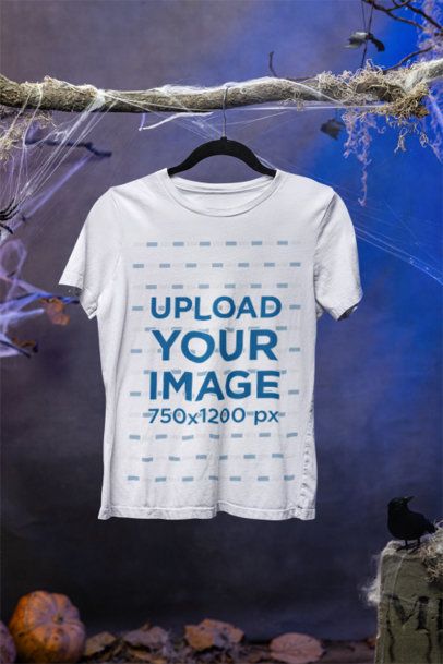 Halloween-Themed Mockup of a Women's Bella Canvas T-Shirt Hanging from a Branch m51281