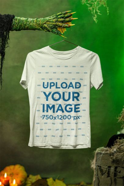 Halloween-Themed Mockup of a Monster Holding a Hanger with a Bella Canvas T-Shirt m51284
