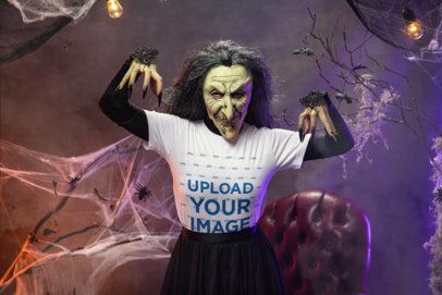 Bella Canvas T-Shirt Mockup Featuring a Scary Witch Posing in a Haunted House