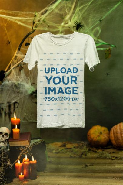 Mockup Featuring a Bella Canvas T-Shirt Hanging in a Halloween-Decorated Setting m51290