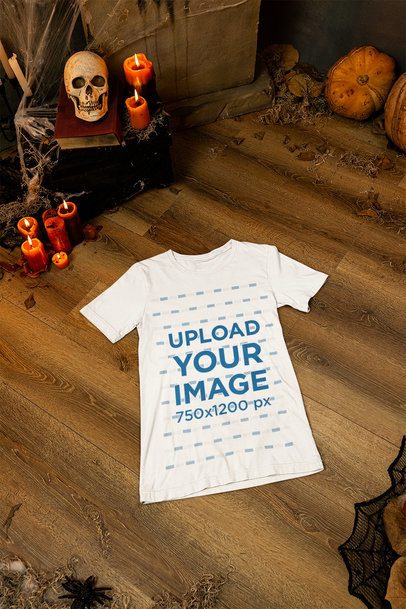 Halloween-Inspired Mockup of a Bella Canvas Tee Flat Laid on a Haunted House's Floor m51296