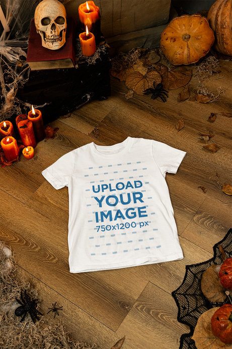 Halloween-Themed Mockup Featuring a Bella Canvas T-Shirt on a Horror House's Floor