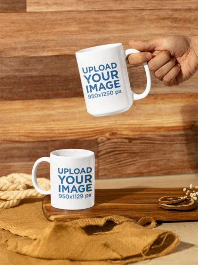 Mockup Featuring Two Different-Sized Coffee Mugs Placed in a Wooden Setting