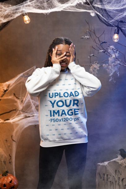 Mockup of a Scared Woman Wearing a Gildan Sweatshirt in a Halloween Setup m51253