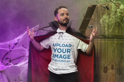 Halloween-Themed Mockup of a Man Wearing a Bella Canvas T-Shirt and a Dracula Cape