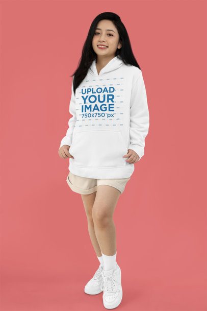 Simple Mockup Featuring a Happy Woman Standing in a Studio with a Pullover Hoodie