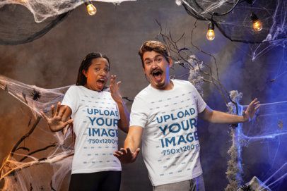 Halloween-Themed Mockup of a Man and a Woman Wearing Matching Bella Canvas T-Shirts