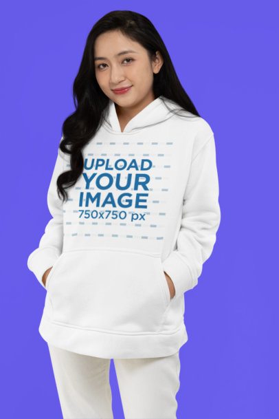 Mockup of a Woman with a Shy Smile Wearing a Pullover Hoodie in a Studio
