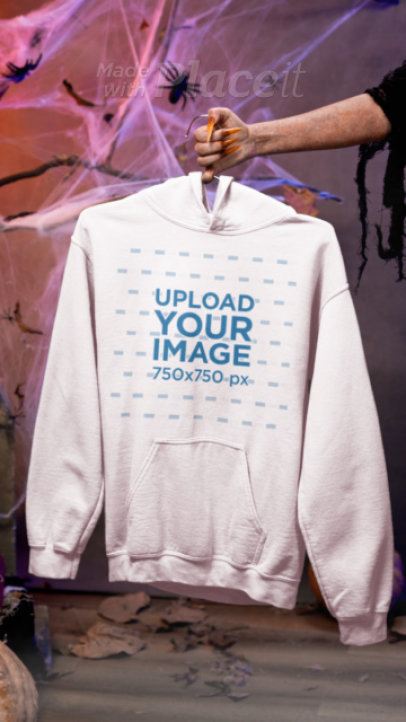 Halloween-Themed Video of a Monster Holding a Gildan Hoodie