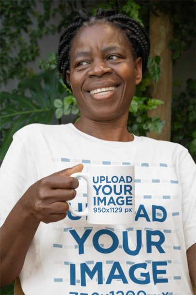 Bella Canvas Tee Mockup of a Joyful Elderly Woman Holding an 11 oz Coffee Mug m51504