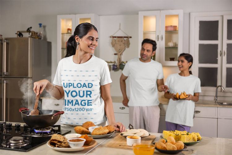 Scott International T-Shirt Mockup Featuring a Happy Woman Cooking Dinner With Her Family