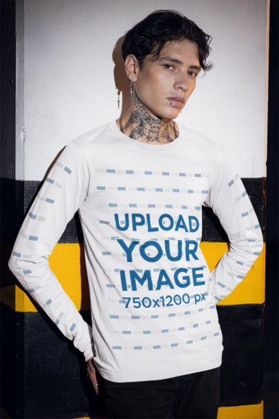 Grunge-Styled Mockup of a Tattooed Man in a Bella Canvas Long-Sleeve Tee