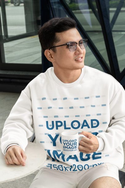 Oversized Sweatshirt Mockup Featuring a Man with Glasses Holding an 11 oz Coffee Mug