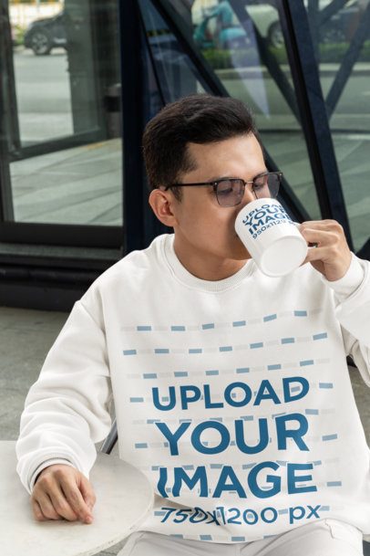Sweatshirt Mockup Featuring a Man with Glasses Drinking from an 11 oz Coffee Mug