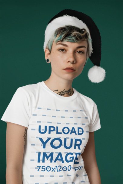 T-Shirt Mockup of an AI-Generated Woman With Tattoos Wearing a Xmas Hat