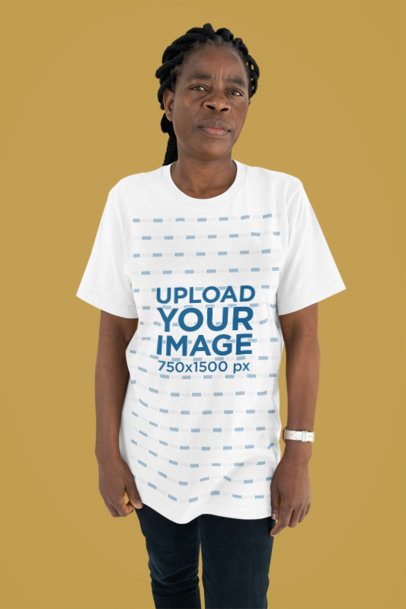 T-Shirt Mockup of an Elderly Woman Standing in a Studio with a Customizable Background