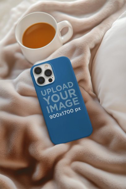 Print Mockup Featuring an AI-Created Phone Case Placed on a Cozy Bed With a Cup of Tea