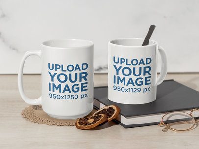 Mockup of an 11 Oz and 15 Oz Coffee Mugs Placed in a Table With a Pair of Glasses and a Book
