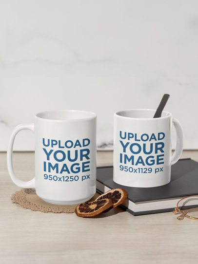 Drinkware Mockup of Two Coffee Mugs Placed on a Wooden Table With Dried Orange Slices m51018