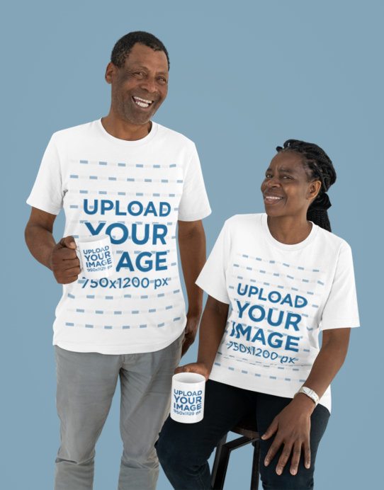 T-Shirt Mockup Featuring a Smiling Elderly Couple Holding Coffee Mugs in a Studio