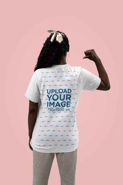 Back-View Mockup Featuring a Woman Pointing at Her New Bella Canvas T-Shirt