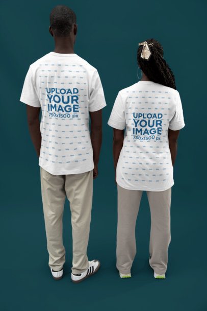 Bella Canvas T-Shirt Mockup Featuring the Back-View of a Man and Woman Standing in a Studio