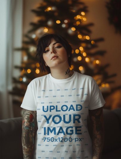 AI-Created Mockup of a Tattooed Woman Wearing a T-Shirt in a Christmas-Decorated Room