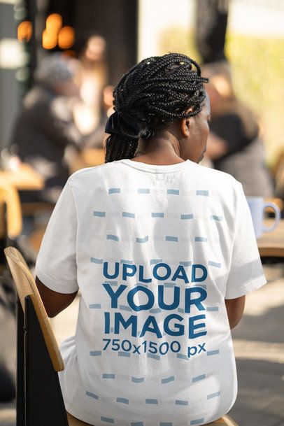 Back-View Bella Canvas T-Shirt Mockup of a Woman Sitting on a Chair
