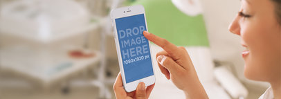 Young Woman Using Her iPhone 6 Plus at the Spa