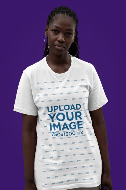 Bella Canvas Tee Mockup Featuring a Serious Woman Standing Against a Customizable Backdrop