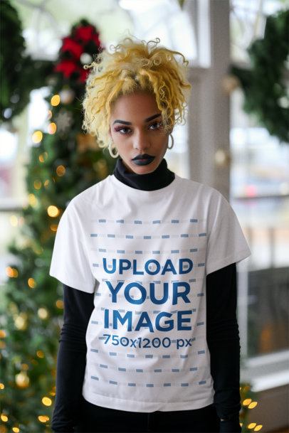Mockup of an AI-Generated Woman Wearing a Crewneck Tee in Front of a Xmas Tree