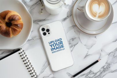 Mockup of an AI-Generated Clear Phone Case Lying on a Marble Table With Coffee and a Croissant m51607