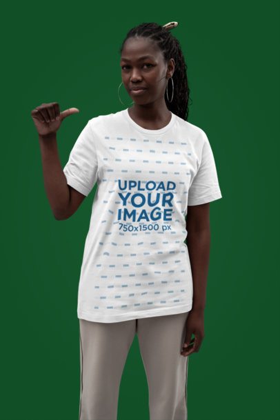 Mockup of a Woman with Big Earrings Pointing at Her New Bella Canvas T-Shirt