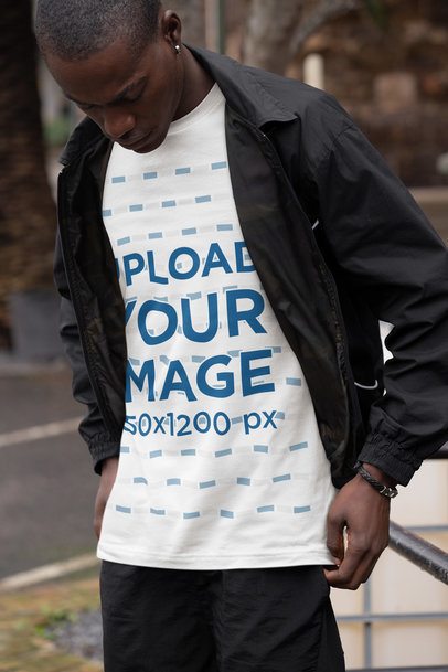 Bella Canvas T-Shirt Mockup of a Serious Man Standing by the Street