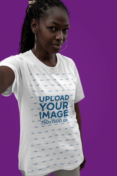 Bella Canvas T-Shirt Mockup Featuring a Woman with Earrings Taking a Selfie