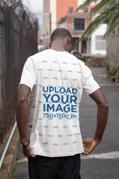 Back-View Mockup Featuring a Man Wearing a Short-Sleeve Bella Canvas T-Shirt