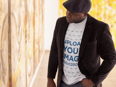 Tshirt Mockup of a Senior Man Wearing a Beret at an Art Exhibition