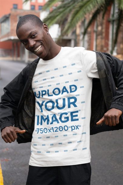 Mockup Featuring a Happy Man Pointing at His Bella Canvas Crewneck T-Shirt