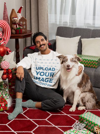 Gildan Sweatshirt Mockup of a Man With His Dog in a Christmas-Decorated Living Room