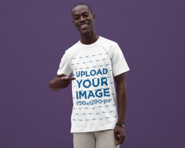 Mockup of a Smiling Man Pointing at His Bella Canvas Round-Neck T-Shirt