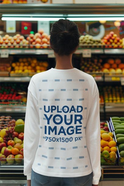 Back-View Long Sleeve Tee Mockup of a Woman Standing in Front of Fruit Racks