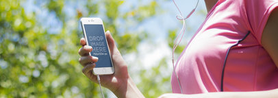 Mockup of a Young Woman Using Her iPhone 6 While Jogging
