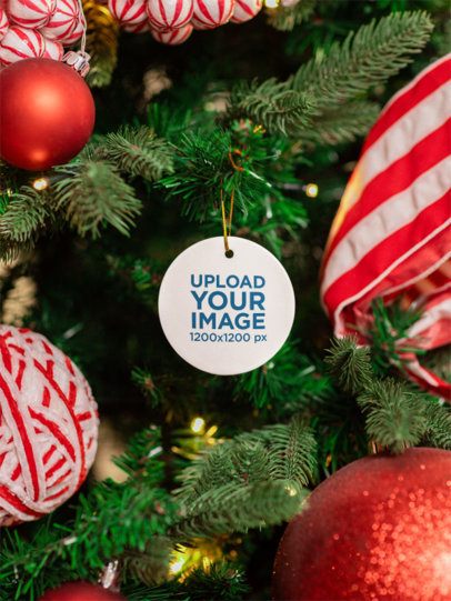 Print Mockup Featuring a Ceramic Ornament Hanging From a Christmas Tree m52075