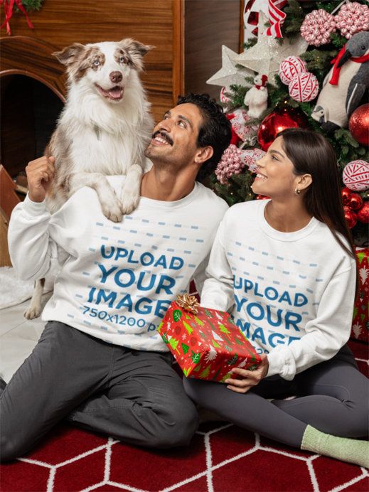 Sweatshirt Mockup of a Happy Couple Posing in a Xmas-Decorated Room with Their Dog