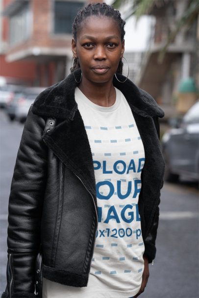 Mockup of a Woman Wearing a Bella Canvas Tee Under a Winter Garment on the Street